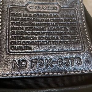 Coach black bag , tear in side seam. Could be a rehab bag